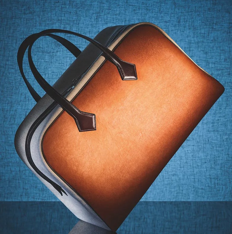 Close-up of a Reishi™ Fine Mycelium handbag showing its smooth grain texture and refined, leather‑like finish crafted through MycoWorks’ Fine Mycelium™ process.